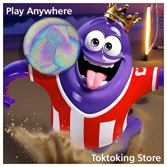 Glimbo King purple mascot jumping to head reflective glow soccer ball on beach at twilight with ocean waves background